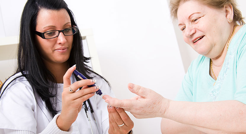 A medical personel administering a diabetes test