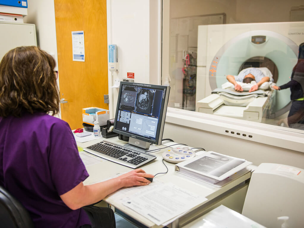 A medical personel doing a medical examination on a patient